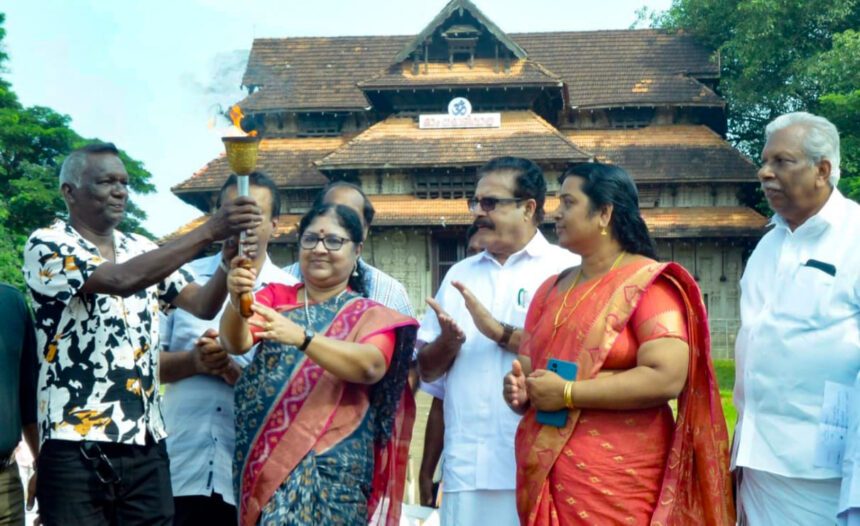 Minister Dr. Dr. R. Bindu handed over The torch to I.M. Vijayan former Indian football captain